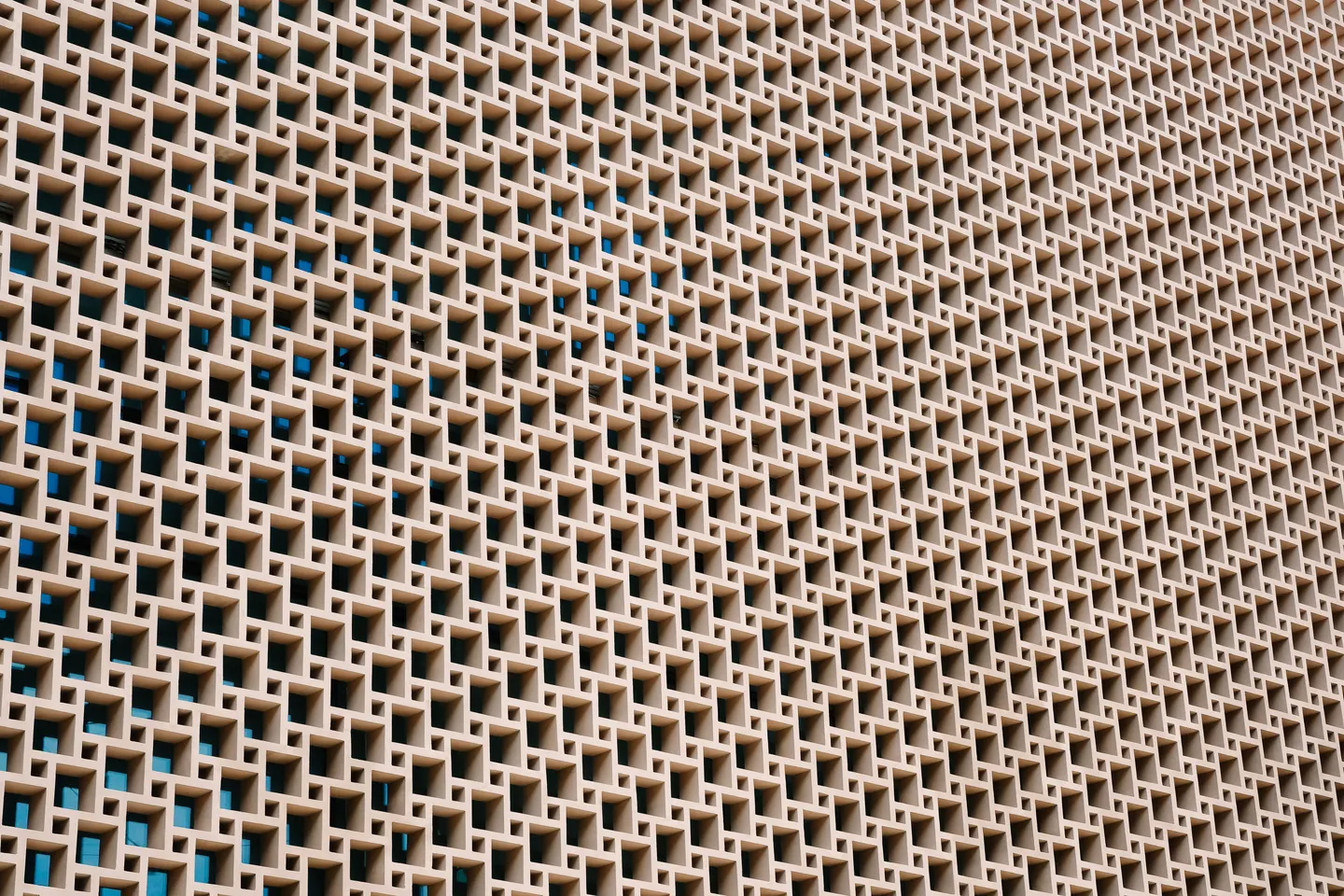 Geometric shapes and shadows on a concrete wall