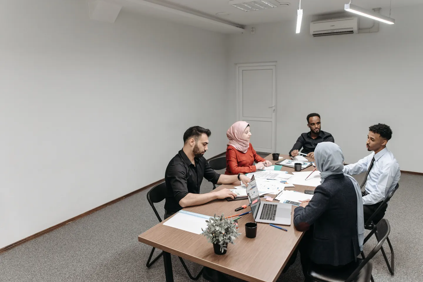 People discussing a project around a table
